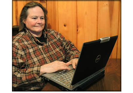 A person sitting in front of a computer